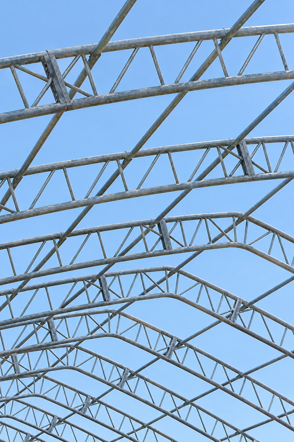 Uncovered double trusses against a blue sky