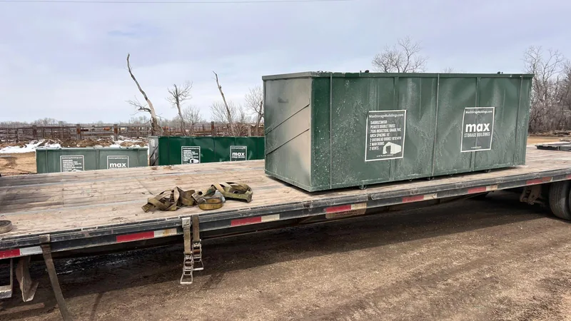 MAX building-component crate on a flatbed trailer