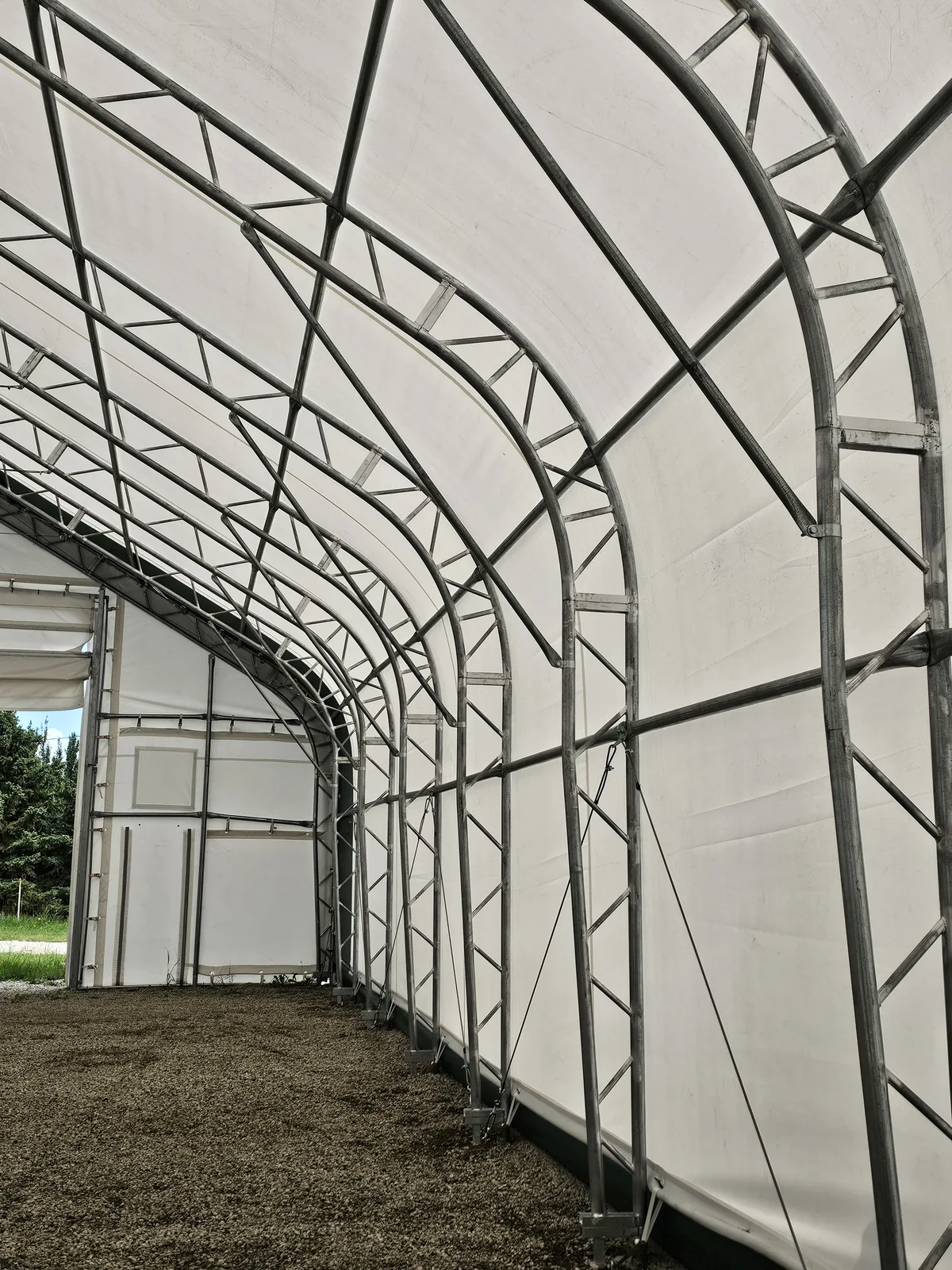 Steel trusses and diagonal bracing inside a fabric building from the MAX photo collection