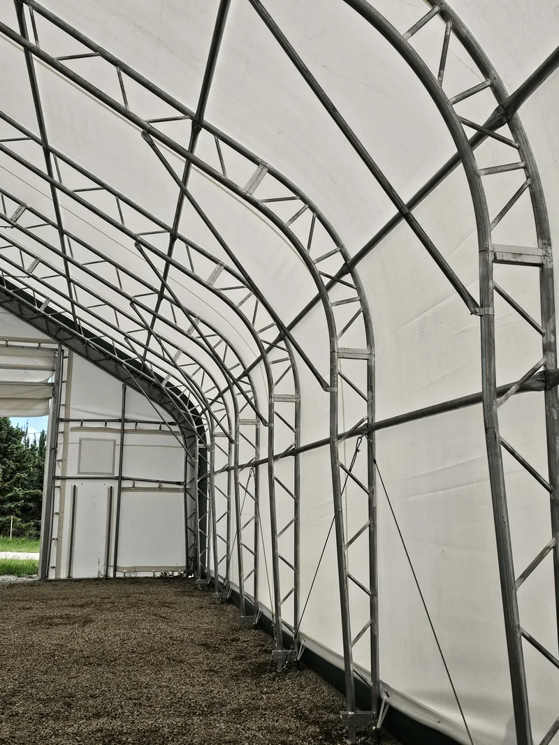 Steel trusses and diagonal bracing beneath the fabric cover